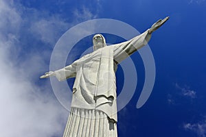 REDEEMER CHRIST, RIO DE JANEIRO, BRAZIL - APRIL 06, 2011: Bottom view of the Christ RedeemerÃÂ´s Statue. The deep blue sky behind.