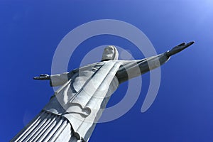 REDEEMER CHRIST, RIO DE JANEIRO, BRAZIL - APRIL 06, 2011: Bottom view of the Christ RedeemerÃÂ´s Statue. The deep blue sky behind.