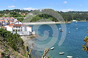 Small fishing village with boats and beach. Redes, Galicia, Spain. photo