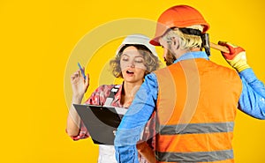 Redevelopment of home. Couple look documents. Control process. Renovation concept. Discussing renovation with contractor photo