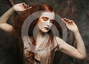 Redhair woman with bright creative make up