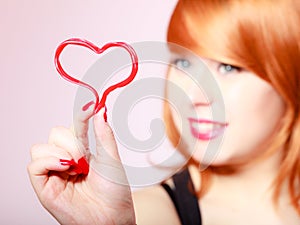 Redhair woman girl holding valentine red heart love. Valentines day.
