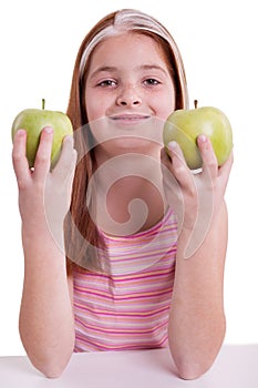 Redhaired girl with green apple
