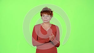 Redhaired woman in the theater claps and she does not like the actors` play. Green screen