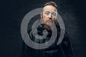 Redhead bearded male in leather jacket.