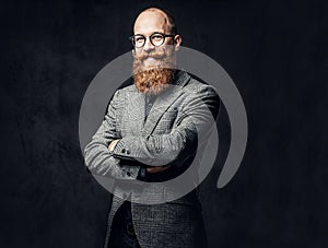 Redhead bearded male in a suit.