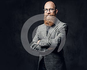 Redhead bearded male in a suit.