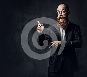 Redhead bearded male in a suit.