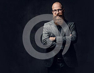 Redhead bearded male in a suit.