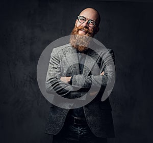 Redhead bearded male in a suit.