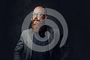 Redhead bearded male in a suit.