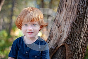 Redhead boy with long hair