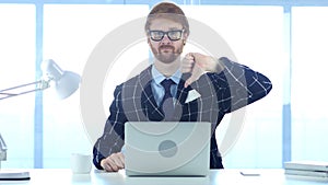 Redhead Businessman Doing Thumbs Down gesture at Work