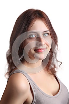 Redhead caucasian girl 18 years old in beige shirt, closeup.