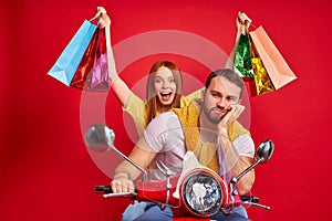 Redhead female with gifts persuaded the boyfriend for shopping