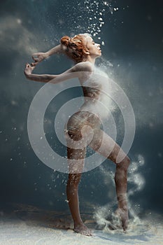 Redhead fitness girl female adult woman dancer in dust