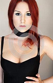 redhead girl in black corset with ribbon