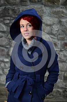 Redhead girl in blue coat