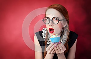 Redhead girl with cupcake