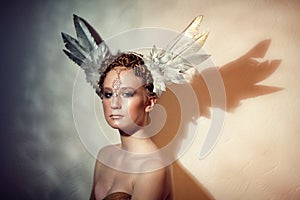 Redhead girl in feather headdress