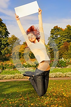 Redhead girl jumping