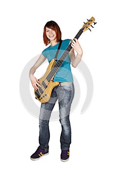 Redhead girl playing bass guitar and smiling