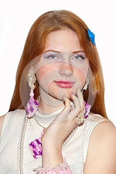 Redhead girl showing jewelry