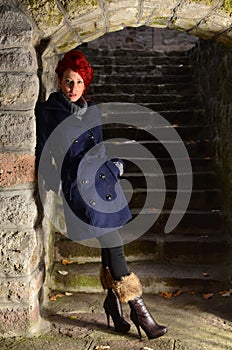 Redhead girl on stone stairways