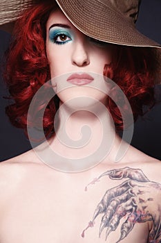 Redhead girl with tattoo