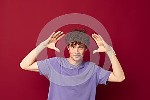 Redhead guy with curly hair posing gesture with hands