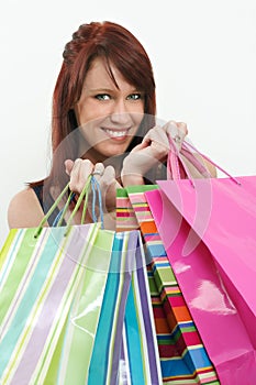 Redhead holding shopping bags