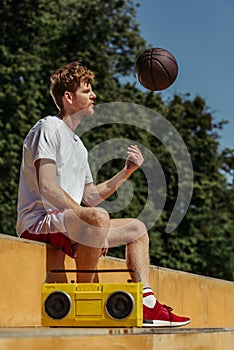 redhead man playing with ball while