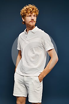 redhead man in white polo t photo