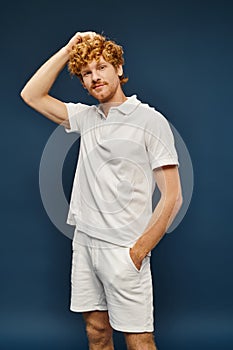 redhead man in white polo t photo