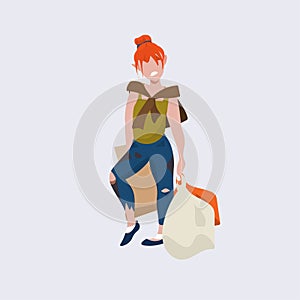 Redhead poor woman beggar standing with bags tramp bum girl begging homeless jobless concept flat full length