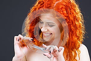 Redhead with scissors