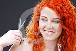 Redhead with scissors