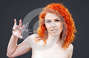 Redhead with scissors