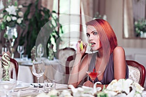 redhead woman with drink