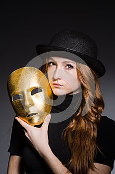 Redhead woman in hat iwith mask in hypocrisy consept