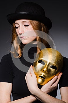 Redhead woman in hat iwith mask in hypocrisy consept photo