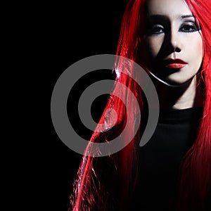 Redhead woman portrait in darkness