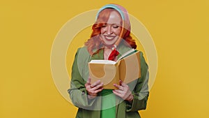 Redhead woman reading funny interesting fairytale story book, leisure hobby, education, learning