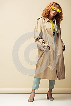 Redhead woman in trench coat and
