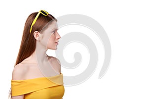 Redheaded female in yellow top and sunglasses