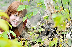 Redheaded girl in forest