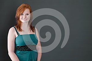 Redheaded young smiling girl - portrait