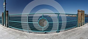 Redondo Beach pier rail with dolphin photo