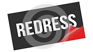 REDRESS text on black red sticker stamp