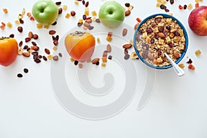 Reduce callories. Top view of muesli bowl with fresh fruits. photo